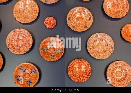 Ceramic plates from 15th century Valencia Spain decorate the walls at the Galleys Room at the Sintra National Palace in Sintra, Portugal. The Romanticist architectural and fairytale palaces draws tourists from around the world. Stock Photo