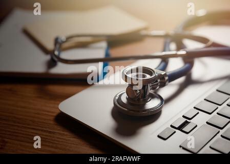 Stethoscope on laptop keyboard, telehealth, telemedicine concept Stock Photo