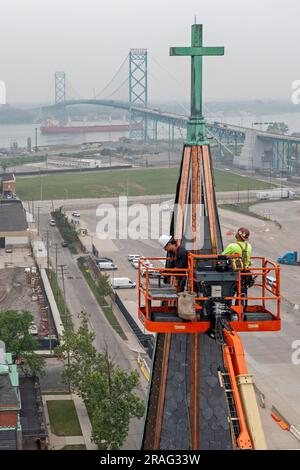 Detroit, Michigan - Workers repair the towers of the Basilica of Ste. Anne de Detroit. Ste. Anne was founded by French explorers in 1701. This buildin Stock Photo