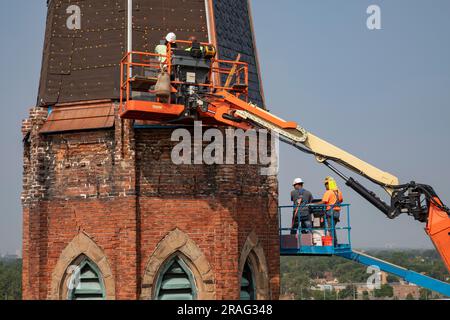 Detroit, Michigan - Workers repair the bell towers of the Basilica of Ste. Anne de Detroit. Ste. Anne was founded by French explorers in 1701. This bu Stock Photo