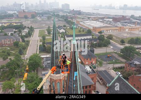 Detroit, Michigan - Workers repair the towers of the Basilica of Ste. Anne de Detroit. Ste. Anne was founded by French explorers in 1701. This buildin Stock Photo