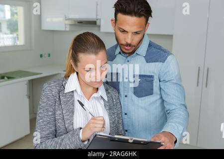 businessman showing real estate concept on a clipboard Stock Photo