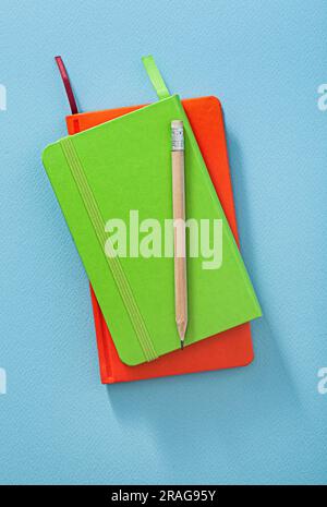 Wooden Pencil On Note Pads Close Up Stock Photo