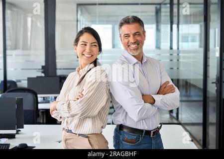 Happy smiling professional diverse executives team standing in office, portrait. Stock Photo