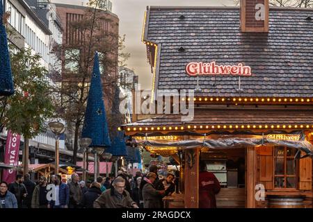 Picture of stands selling mulled wine and sweets in Duisburg Christmas market, also called weihnachtsmarkt, in winter, in Germany. Stock Photo