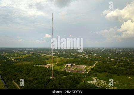 Aerial view of telecommunications cell phone tower with wireless communication 5g antennas for network signal transmission. Stock Photo