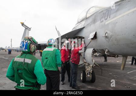 Sailors assigned to the ÒBlacklionsÓ of Strike Fighter Squadron (VFA) 213, conduct preflight aircraft checks on the flight deck of the worldÕs largest aircraft carrier USS Gerald R. Ford (CVN 78), July 1, 2023. Gerald R. Ford is the U.S. NavyÕs newest and most advanced aircraft carrier, representing a generational leap in the U.S. NavyÕs capacity to project power on a global scale. The Gerald R. Ford Carrier Strike Group is on a scheduled deployment in the U.S. Naval Forces Europe area of operations, employed by U.S. Sixth Fleet to defend U.S., allied, and partner interests. (U.S. Navy photo b Stock Photo