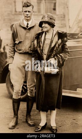 Charles Lindbergh with his mother Evangeline Lindbergh, full-length portrait, Underwood & Underwood, 1927 Stock Photo