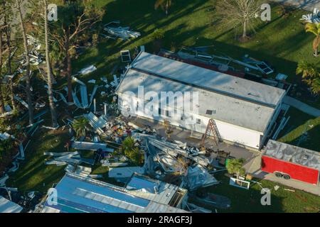 Destroyed by hurricane Ian suburban houses in Florida mobile home residential area. Consequences of natural disaster. Stock Photo