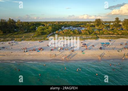 High angle view of crowded Nokomis beach in Sarasota County, USA. Many people enjoing vacations time swimming in ocean water and relaxing on warm Flor Stock Photo