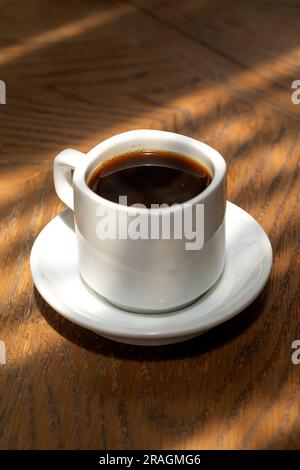 cup of coffee in a wooden table on a beautiful Stock Photo