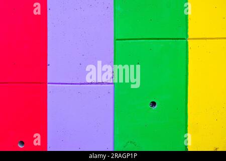 Colorful stripes painted on the wall, vertical and horizontal, in bold saturated colors. Stock Photo