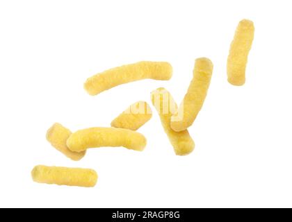 Many tasty corn sticks falling on white background Stock Photo