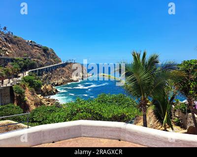 La Quebrada is a cliff with a channel in the port of Acapulco, Guerrero, Mexico where the famous diving is done by young people who climb it Stock Photo