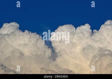 A blue evening sky filled with puffy white clouds in rural Alberta,Canada, Stock Photo