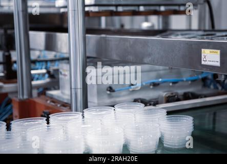Plastic bowls finish product from plastic injection molding machine. Stock Photo