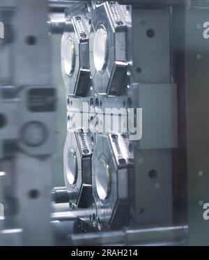 Close up plastic injection molding machine. Stock Photo