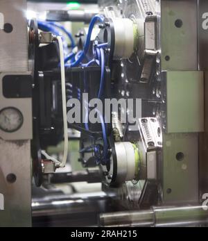 Close up plastic injection molding machine. Stock Photo
