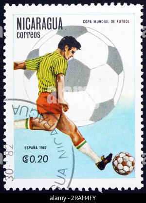 NICARAGUA - CIRCA 1982: a stamp printed in Nicaragua shows soccer player in action, 1982 World Cup, Spain, circa 1982 Stock Photo