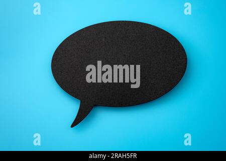 Isolated Speech Bubble on Blue Background with Copy Space Illustration for Conversational Chat Icons, Paper-Cut Message Designs, and Conceptual Commun Stock Photo
