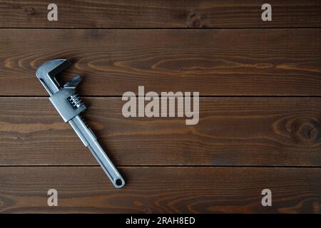 motor wrench tool isolated on wooden table Stock Photo