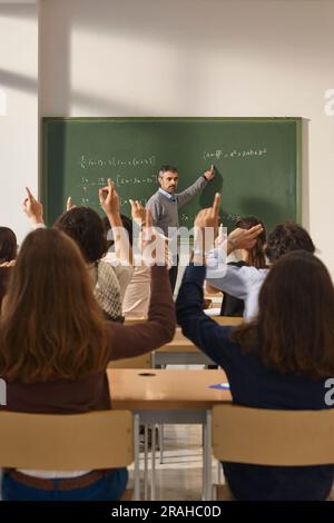 Math teacher giving lessons. Classroom with students. School education ...