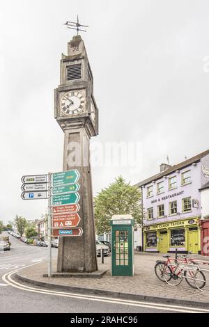 The Clock Tavern, the defibrillator phone box, road signage and the Westport Town Clock at Westport County Mayo, Irleand. Stock Photo