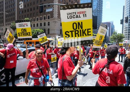 Los Angeles, United States. 03rd July, 2023. Striking hotel workers holding placards rally outside the Intercontinental Los Angeles Downtown. Southern California hotel workers are ON STRIKE! Thousands walked off the job at properties across Downtown Los Angeles and Santa Monica, in an effort to secure higher pay and improvements in health care and retirement benefits. Credit: SOPA Images Limited/Alamy Live News Stock Photo