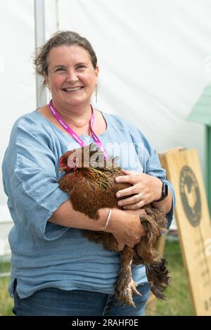 East Molesey, Surrey, UK. 3rd July, 2023. Barbara the Brahma Chicken at the RHS Hampton Court Palace Garden Festival set the grounds of the historic Hampton Court Palace. The Festival runs from 4th July to Sunday 9th July 2023. Credit: Maureen McLean/Alamy Live News Stock Photo