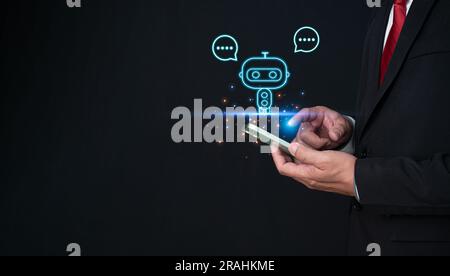 Businessman hand uses a smartphone to type live chat, ask, answer with an artificial intelligence system. chat bot. Ai. Stock Photo