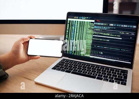 Laptop, coding and hands with mockup phone for website hacking, programming or cybersecurity. Information technology, software and person on Stock Photo