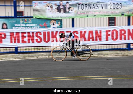 Bandung Regency, West Java, Indonesia. July 4, 2023. A participant from East Java, Wiji Nurul raced quickly in the old bicycle race number, competing for speed at the VII 2023 National Recreation Sports Festival (Fornas) at the Si Jalak Harupat Stadium, Bandung Regency. The gold medal in the men's old bicycle speed competition was won by a participant from East Java, Wiji Nurul, while the silver medal was won by a participant from Central Java, Wendy. Credit: Dimas Rachmatsyah/Alamy Live News Stock Photo