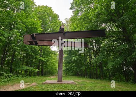 A rusty, I beam column sculpture titled Mahatma, by Mark di Suvero. At Storm King Sculpture and Art Center in New Windsor, New York, United States. Stock Photo