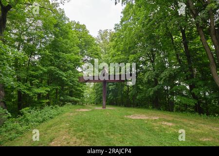 A rusty, I beam column sculpture titled Mahatma, by Mark di Suvero. At Storm King Sculpture and Art Center in New Windsor, New York, United States. Stock Photo