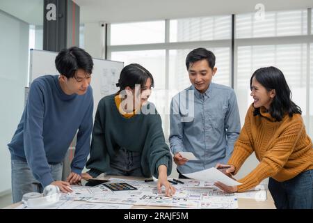 Creative designer choosing color samples for mobile responsive website development with UI/UX. Developing wireframe sketch layout design mockup on Stock Photo