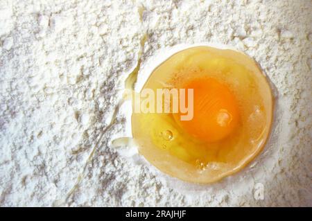 Top view of raw egg and flour Stock Photo