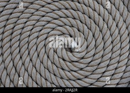 Den Helder, Netherlands. June 30, 2023. Coiled rope on the deck of a sailboat. High quality photo Stock Photo