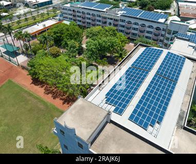 Aerial view  many solar panels on the roof of school Stock Photo