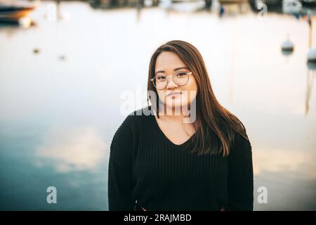 Outdoor portrait of asian plus size model posing by the lake Stock Photo