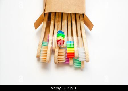 Wooden eco friendly bamboo toothbrushes, brushes in craft corton box isolated on white background Stock Photo