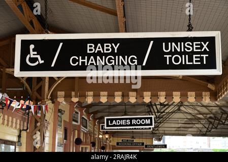 Hanging signs at Kingswear station on the Dartmouth Steam Railway. Stock Photo