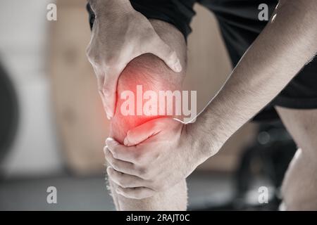 Hand, knee pain and injury with the leg of a man in red highlight during a fitness workout. Healthcare, medical and anatomy with a male athlete Stock Photo