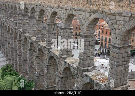 Roman aqueduct, detail of the stone arches of the magnificent 1st Century AD Roman aqueduct spanning the centre of the city of Segovia, Spain Stock Photo