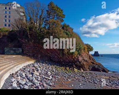 UK, Devon, Torbay, Torquay, Imperial Hotel and Saddle Rock from Beacon Cove. Stock Photo