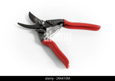 A pair of red-handled garden secateurs in open position, isolated on a white background, UK Stock Photo