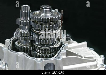 Closeup open car gearbox automatic transmission part on black background Stock Photo