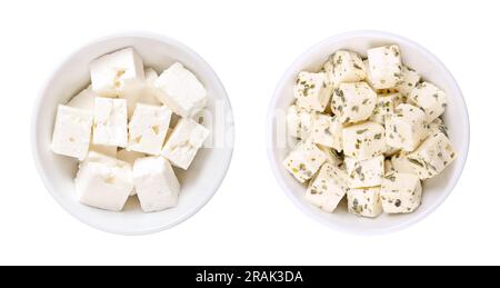 Greek feta cubes, brined cheese, in white bowls. Cheese, matured in brine, with soft, moist texture, and fresh, salty, acidic taste, cut into cubes. Stock Photo