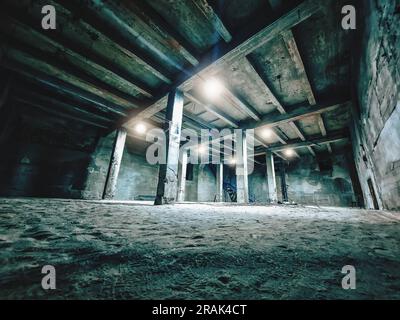 Concrete basement with pillars, lanterns. Stock Photo