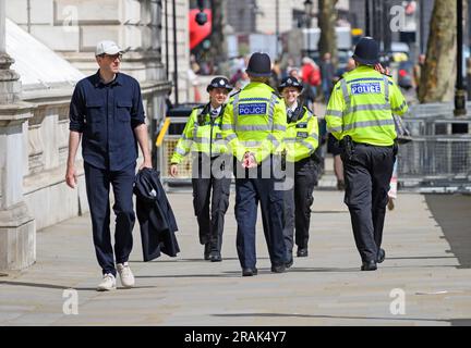 London, UK. Metropolitan Police officers on duty in Whitehall, Westminster Stock Photo