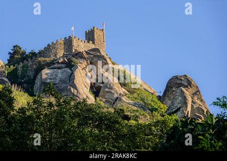 The Castelo dos Mouros, or Castle of the Moors on the Sintra Hills above the historic town of Sintra, Portugal. The medieval castle built during the Moorish occupation in the 8th century dominates the hillside over Sintra. Stock Photo